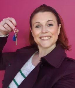 Youbee Becky holding the office keys 