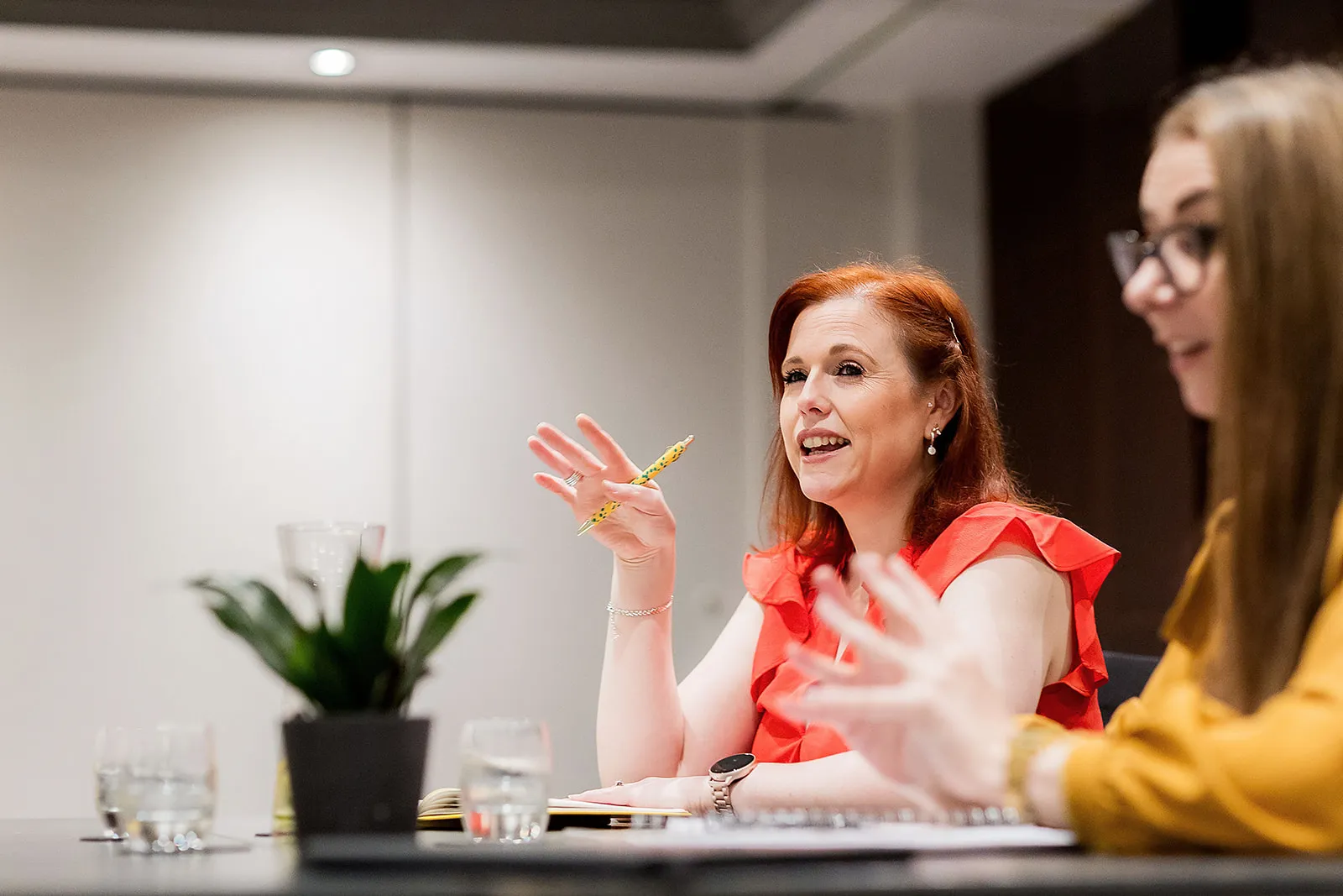 Becky speaking in a meeting